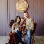 A happy family posing in studio